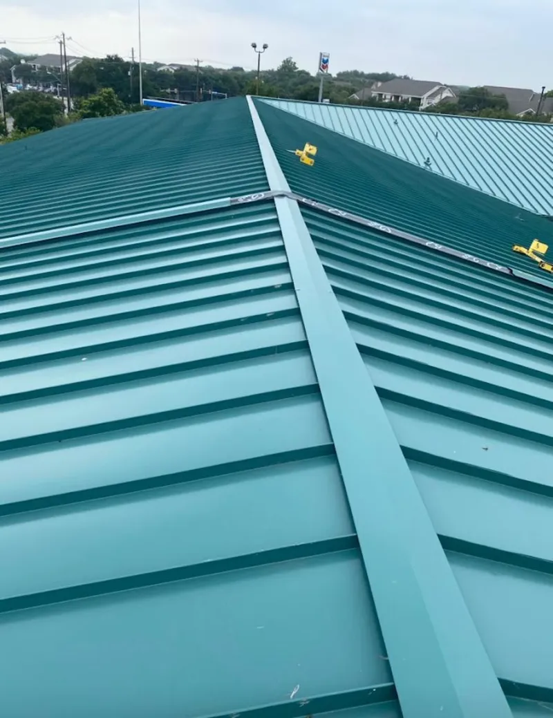 Green commercial metal roof ridge and valley for Metal Roof Repair in Pittsboro